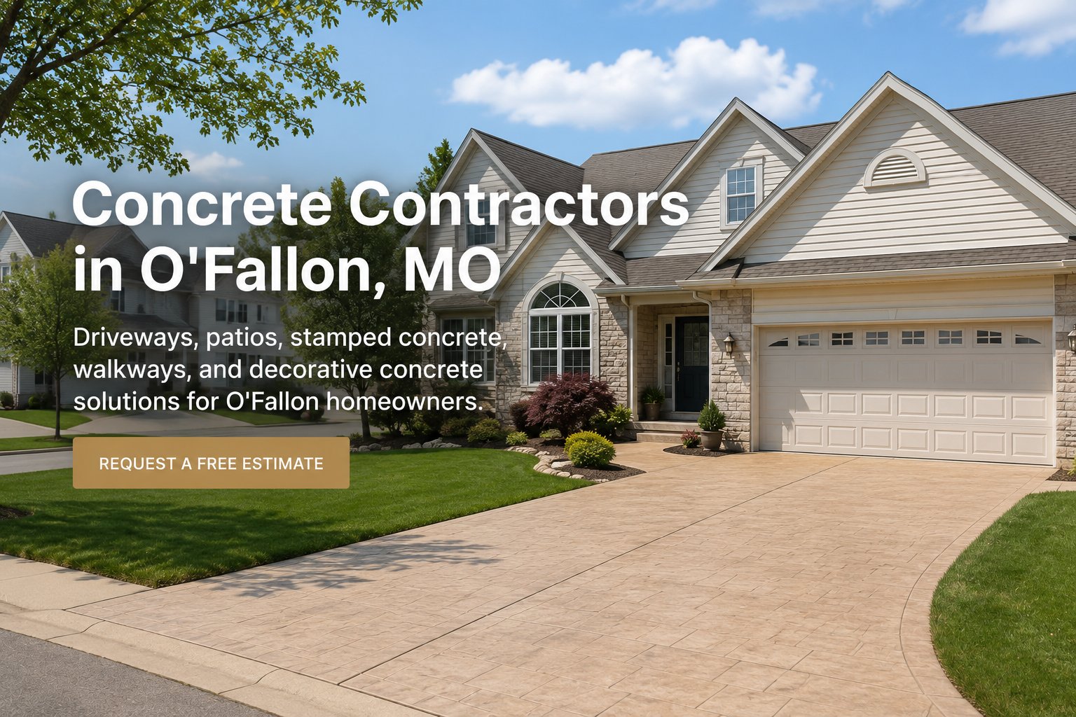 Stamped concrete driveway at a beautiful O'Fallon, Missouri subdivision home with decorative scoring, lush landscaping, and two-car garage